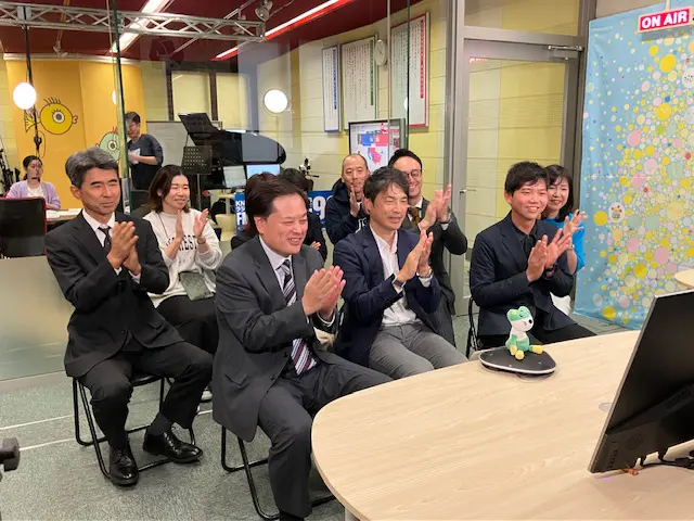 東京の会場とKNBがリモートで結ばれた